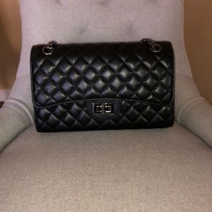 Black shoulder bag with silver chain straps